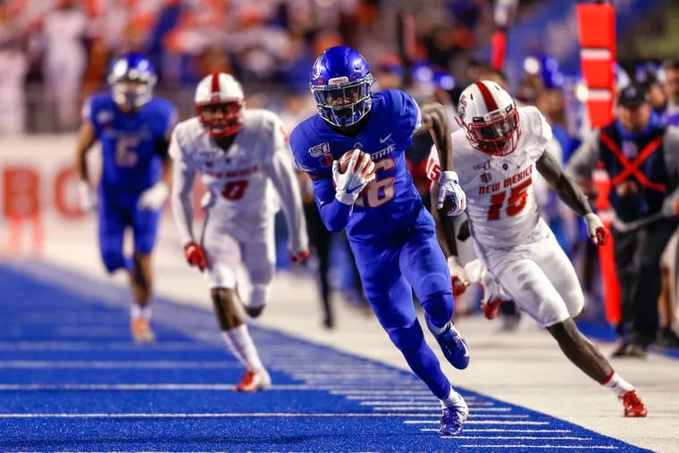 In this Nov. 16, 2019, file photo, Boise State wide receiver John Hightower (16) turns upfield and runs away from the New Mexico defense for a 51-yard touchdown reception.