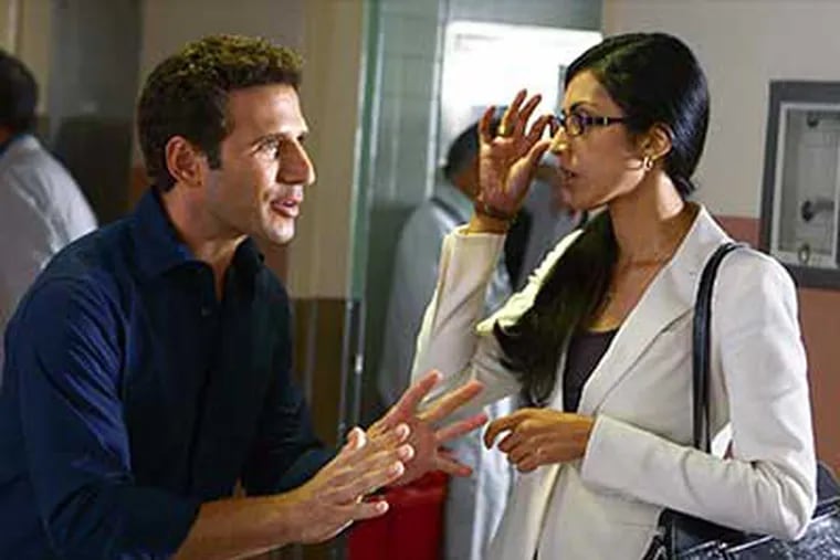 Mark Feuerstein is Dr. Hank Lawson and Reshma Setty plays Divya in "The Royal Pains."