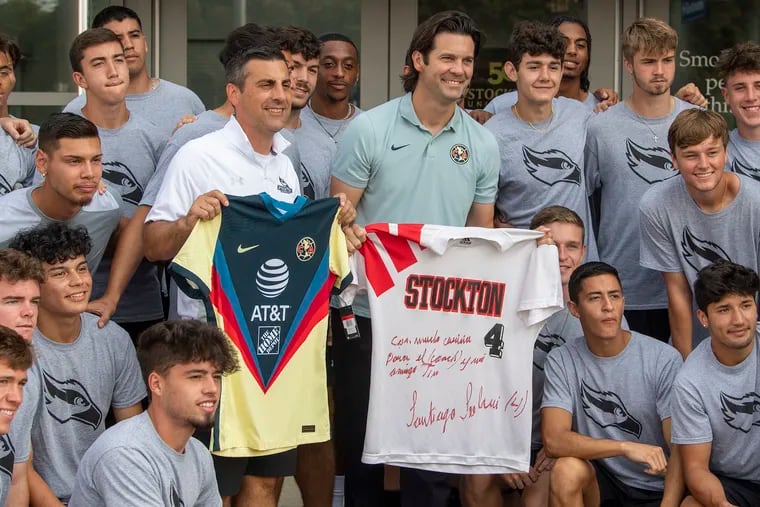 Club America head coach Santiago Solari poses for a photo with the Stockton University soccer team on Tuesday. The Argentine earned New Jersey Athletic Conference Rookie of the Year and NJAC First Team honors while playing for the Ospreys in 1994.