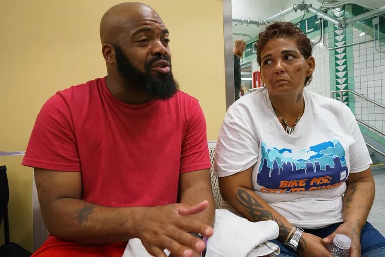 Rohman Griffin, 39, left, and Lisa Velasquez, 38, right, talk with Inquirer reporter Jason Laughlin, in Philadelphia, Friday, August 10, 2018. JESSICA GRIFFIN / Staff Photographer.