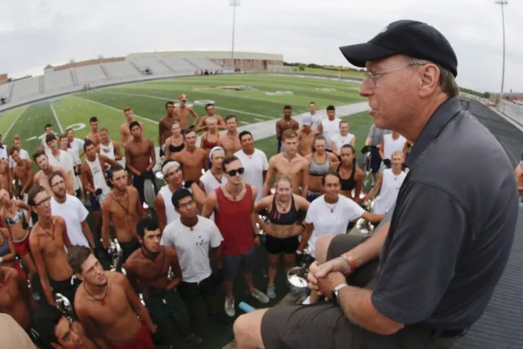 Fred Morrison, executive director of the Crossmen drum corps of San Antonio, Texas, talks to the horn line early Monday July 24, 2017 at Forney High School in Forney, Texas.