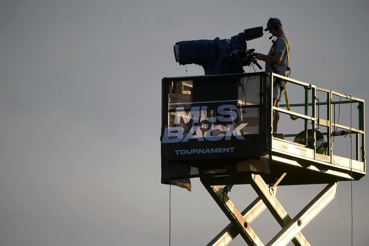 A television camera operator on an elevated platform at the Houston Dynamo-Portland Timbers game on July 18.