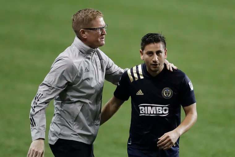Union midfielder Alejandro Bedoya with manager Jim Curtin in November 2020.