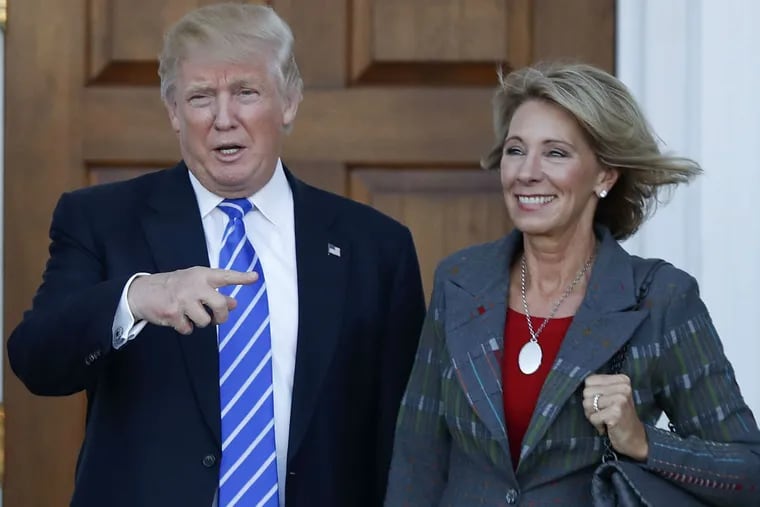 President-elect Trump with Betsy DeVos, his nominee for education secretary.