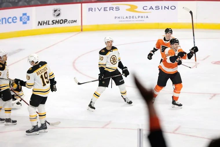 Jackson Cates (59) celebrates his goal that put the Flyers ahead 2-1 in the third period of a preseason game Saturday against the Boston Bruins.