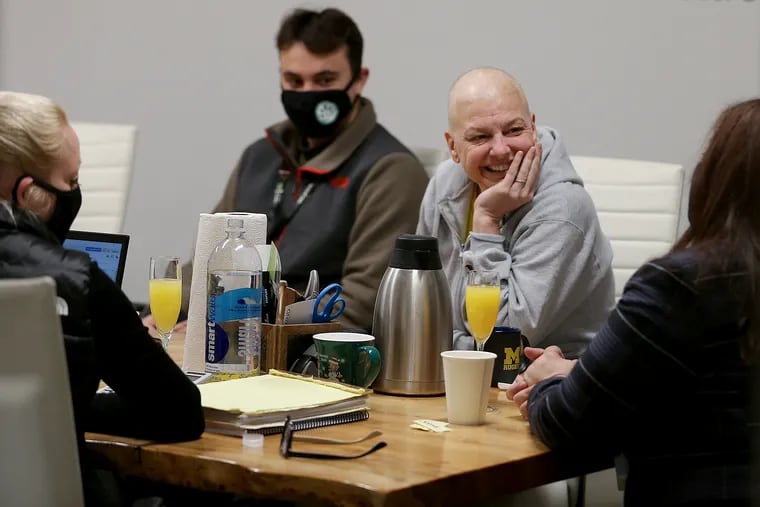 TerraVida founder Christina Visco (right) listens during a meeting at their offices in Jenkintown, Pa. on February 8, 2021. TerraVida is a medical marijuana dispensary chain. Visco just finished chemotherapy for breast cancer and is taking high-dose medical marijuana.
