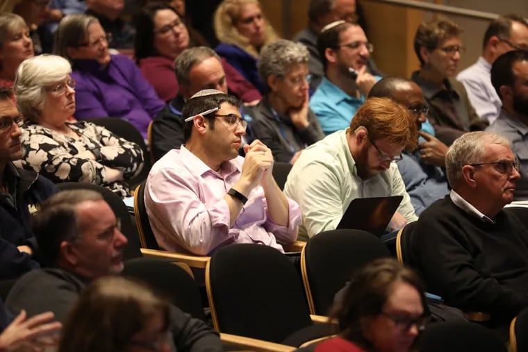 Attendees listen to speakers at the "Securing Sacred Spaces and Places" seminar at the National Constitution Center.