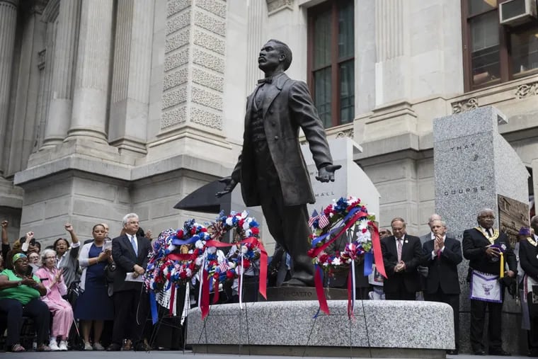 People gather around the statue of Octavius V. Catto at an unveiling ceremony at City Hall