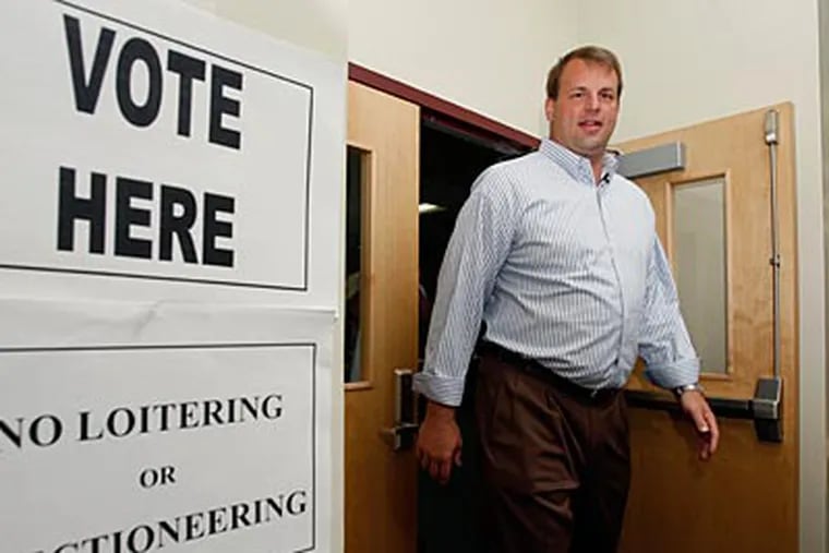 Ex-Eagle Jon Runyan, who won the GOP primary in N.J. for a congressional seat, leaves a Mount Laurel polling place. Runyan will face freshman U.S. Rep. John Adler in November. (MEL EVANS / Associated Press)