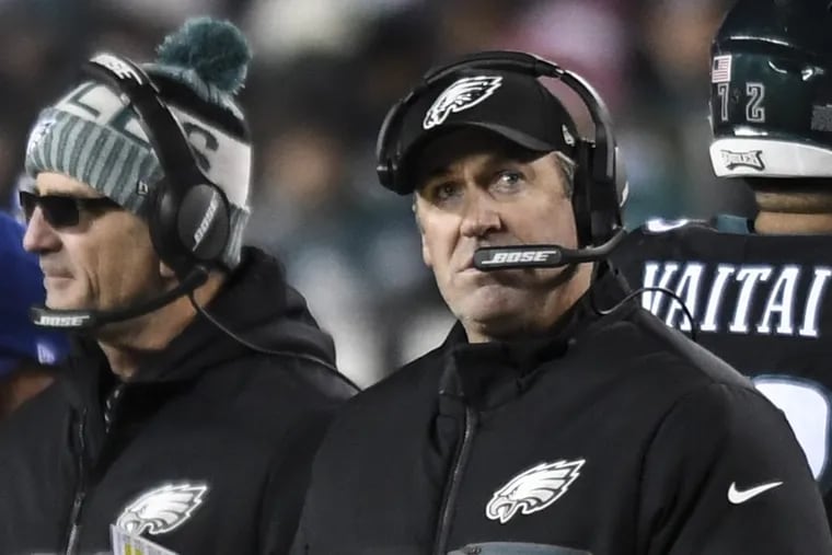 Eagles coach Doug Pederson looks up at the scoreboard during the game against the Raiders.