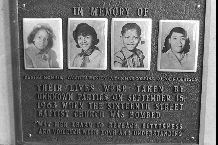 A memorial plaque for the four little girls killed in a bombing at the Sixteenth Street Baptist Church in 1963 is shown in the church’s basement in 1977.