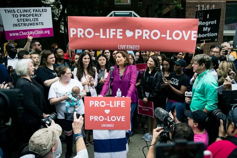 Ashley Garecht speaks as anti-abortion protesters rally near a Planned Parenthood clinic in Philadelphia, Friday, May 10, 2019. Garecht wants an apology from State Representative Brian Sims for confronting her daughters and their friend, all teenagers, outside Planned Parenthood April 18.