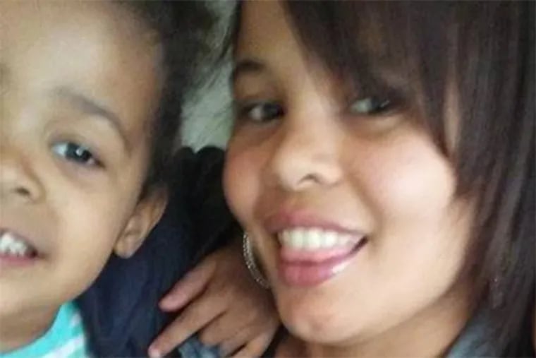 Shakeya Holmes, seen here with her 4-year-old daughter, who fatally shot herself Thursday. Holmes was arrested and charged with third-degree murder.