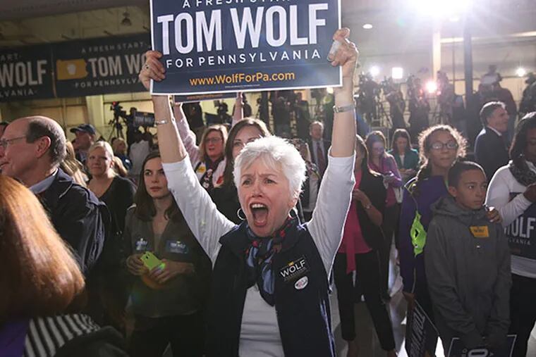 One of the hundreds of Wolf supporters at the Utz Arena in York, PA screams her support for Tom Wolf on election night. ( MICHAEL BRYANT  / Staff Photographer )