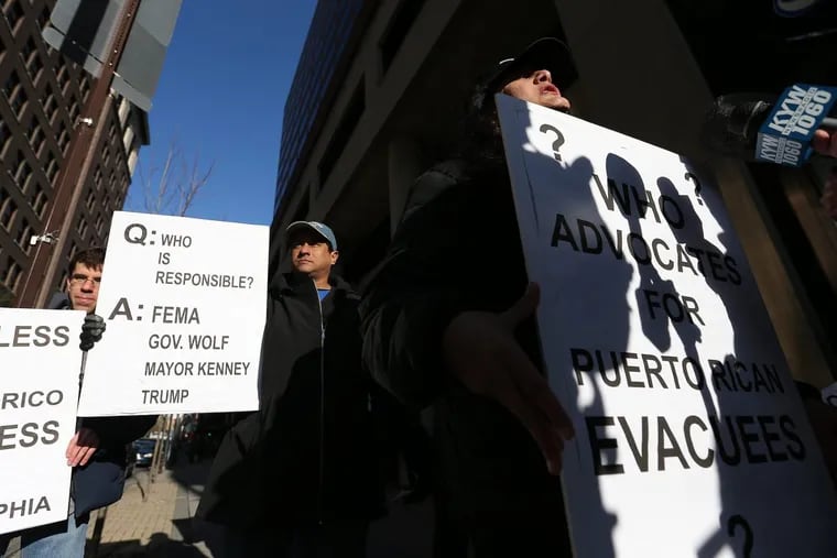 Charito Morales, right, speaks as part of a group of activists advocating for Puerto Rican families who came to Philadelphia following Hurricane Maria protest in front of FEMA's Philadelphia office in Philadelphia, PA on April 18, 2018. DAVID MAIALETTI / Staff Photographer