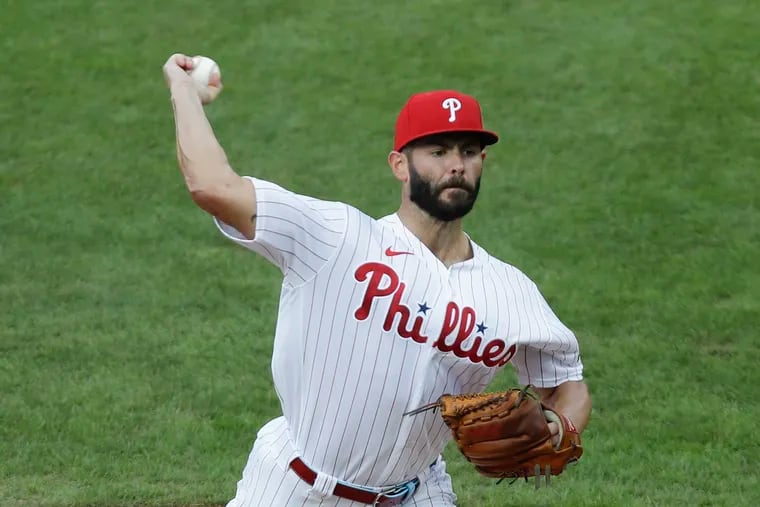 Jake Arrieta delivers in the first inning of the Phillies' 5-0 win over the Braves on Saturday.