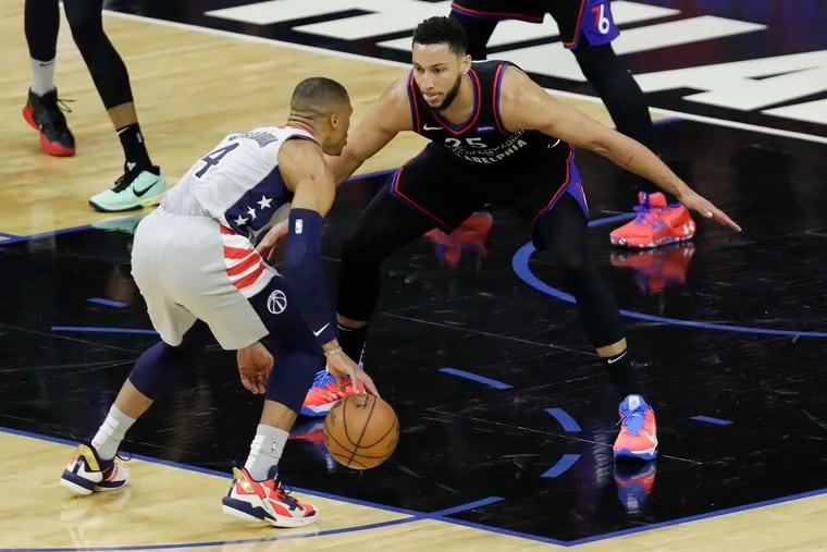 Sixers guard Ben Simmons defends Wizards guard Russell Westbrook (4).