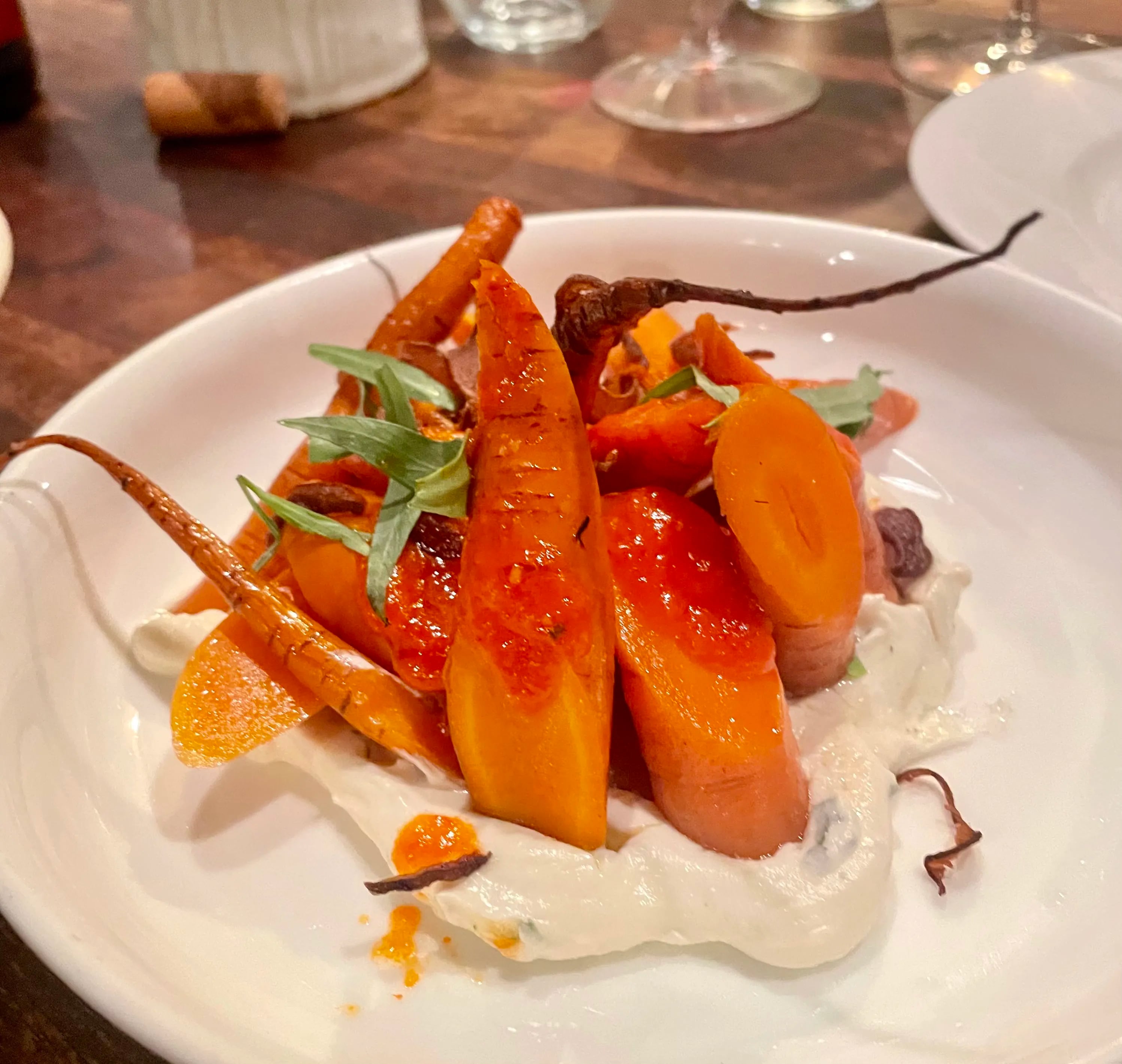 The smoked carrots with chèvre are a signature staple on the ever-changing blackboard menu at Helm BYOB. They are also gluten-free.