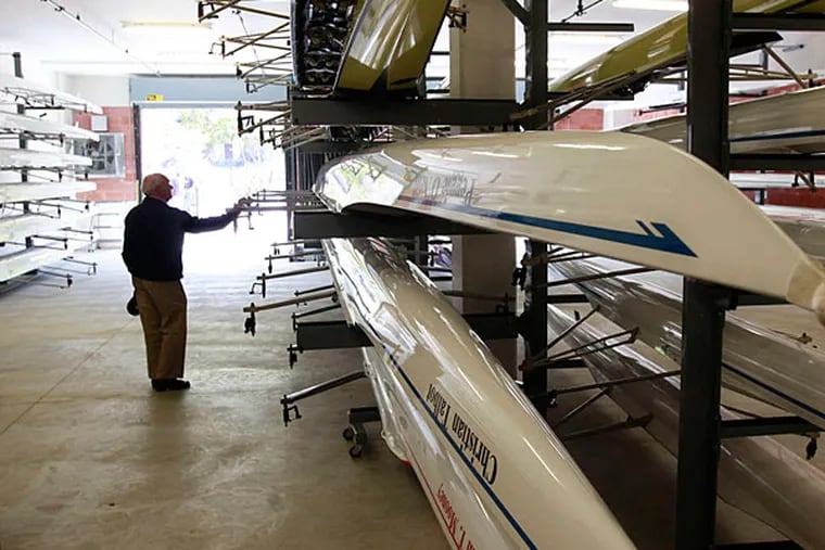 Joseph D'Ascenzo examines Malvern Prep's shells as he tours the new boathouse that it shares with rival Haverford.