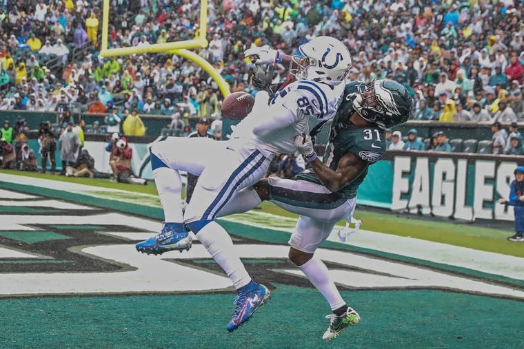 Eagle cornerback Jalen Mills makes a play on the ball against the Colt's Eric Ebron in the end zone to break up a potential touchdown in the second quarter of Sunday's game. The Philadelphia Eagles play the Indianapolis Colts on Sunday , September 23, 2018. MICHAEL BRYANT / Staff Photographer