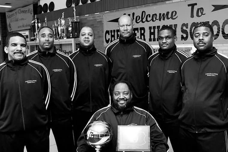 Chester coach Fred Pickett (seated) has retired, leaving the Clippers in the hands of former assistant Larry Yarbray(second from right). Pickett is seen here holding the state championship trophy in March as his assistants look on.