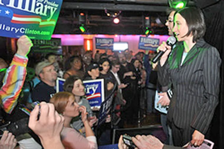 Rue Landau (right) and Ray Murphy, cochairs of Liberty City LGBT Democratic Club, address the crowd at Woody's. Chelsea Clinton popped in last week to lead a presidential pep rally for her mother at the Philadelphia gay bar. (Clem Murray/Inquirer