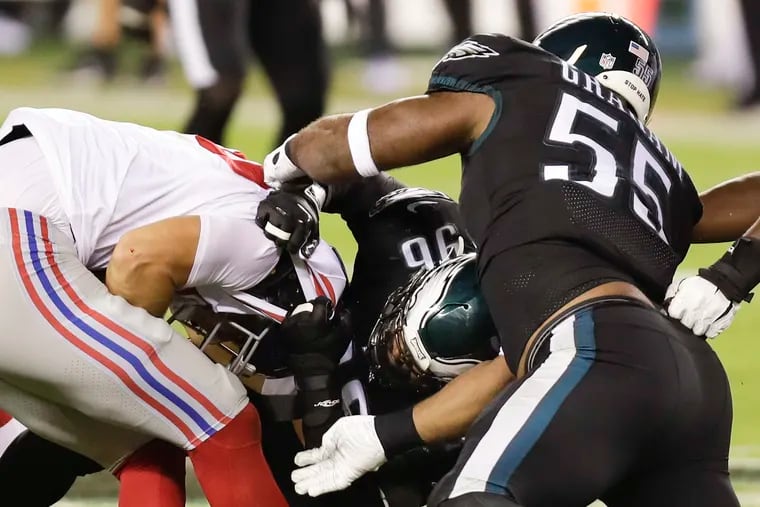 The Eagles' pass rush will be one of the keys to victory Sunday night against the Cowboys. Brandon Graham (right) and Derek Barnett (center) are shown sacking Giants quarterback Daniel Jones in last week's win.