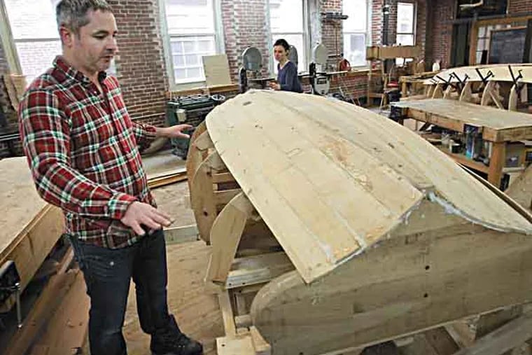 Brett Hart, executive director of Philadelphia Wooden Boat Factory at the workshop at 4520 Worth St in northeast Philadelphia on Friday morning March 15, 2013. The Philadelphia Wooden Boat Factory will be receiving some of the wood from fallen cedar trees in NJ for use in building boats as part of an educational program for youth from "low-wealth" communities. This wood is not the wood being donated, that wood has not been delivered.( ALEJANDRO A. ALVAREZ / STAFF PHOTOGRAPHER  )