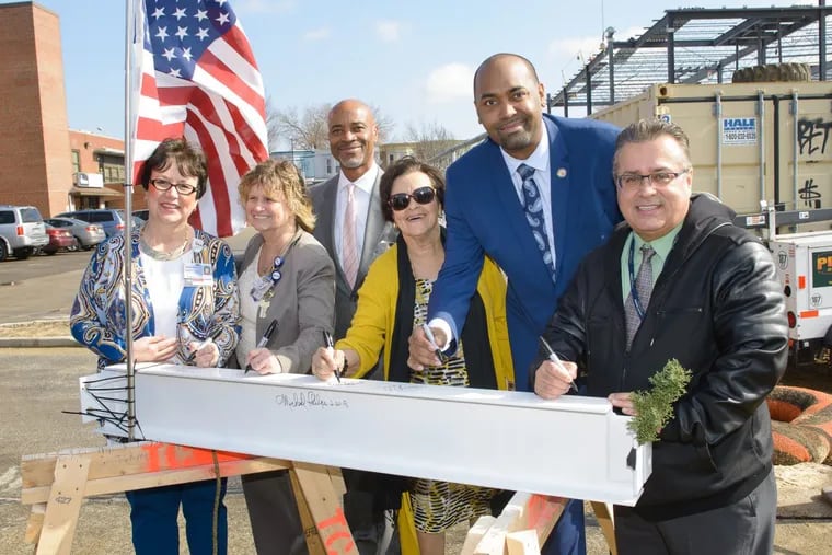 Virtua topped off its $23 million health center in Camden, with health system officials and politicians signing the final steel beam to be put in place.