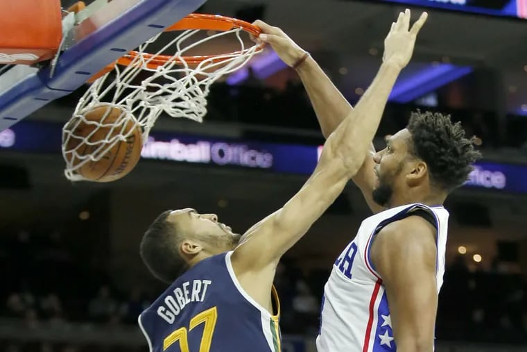 Sixers' Jahlil Okafor dunks over Jazz's Rudy Gobert during the fourth quarter of Monday's game.