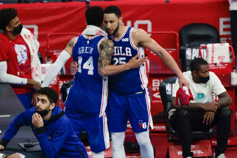 The Sixers' Ben Simmons celebrates with teammate Danny Green as his team is about to win the series against the Wizards in the first round of the NBA playoffs at the Wells Fargo Center in Philadelphia, Wednesday, June 2, 2021.