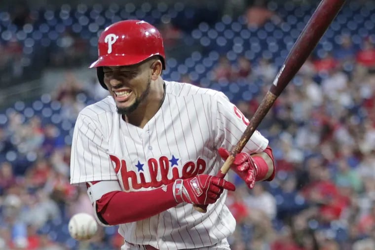 J.P. Crawford of the Phillies grimaces as he is struck by a pitch in the 4th inning against the Cardinals at Citizens Bank Park on June 19, 2018.