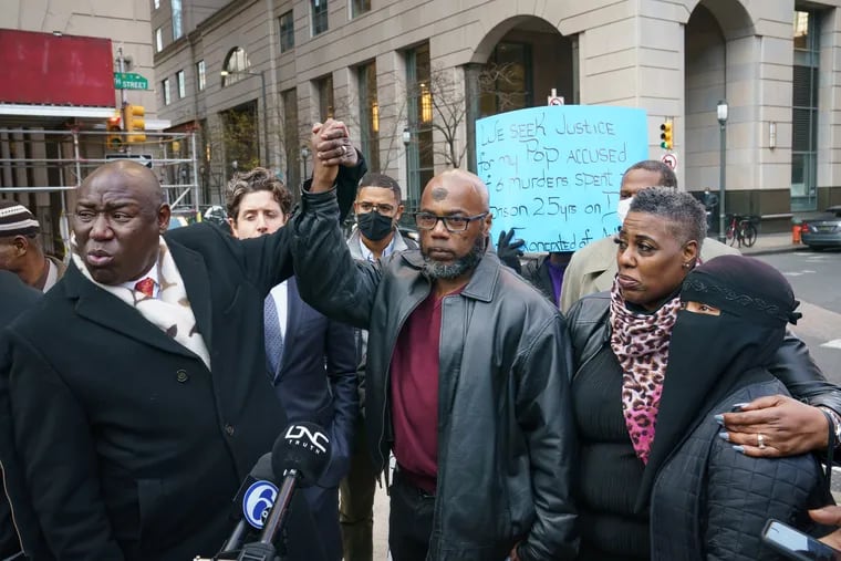 Christopher Williams, center, is seen in a December 2021 file photograph with his attorney Ben Crump, his fiancee Dawn Johnson, and his daughter Sherrie Bradley. They were gathered outside Philadelphia's Criminal Justice Center to announce a lawsuit against the city of Philadelphia, police, and prosecutors on Dec. 1, 2021.