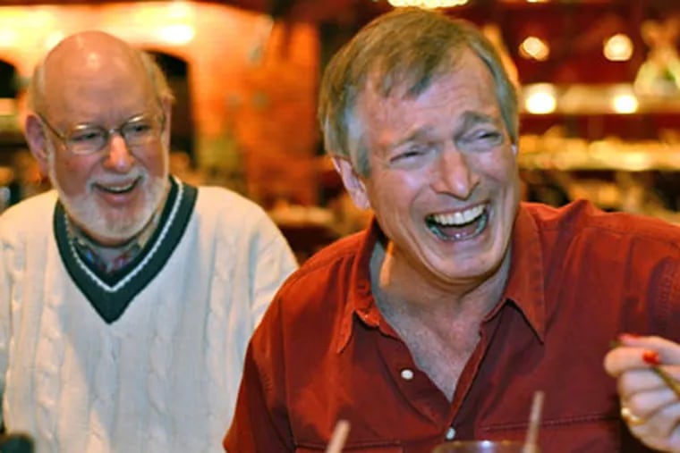 Brevity is the soul of wit for Steve Levy, with Phil Carroll (left) at the ROMEO luncheon in Pennsauken. They gave the news a distinctly Philly feel. (Richard Kauffman / Staff Photographer)