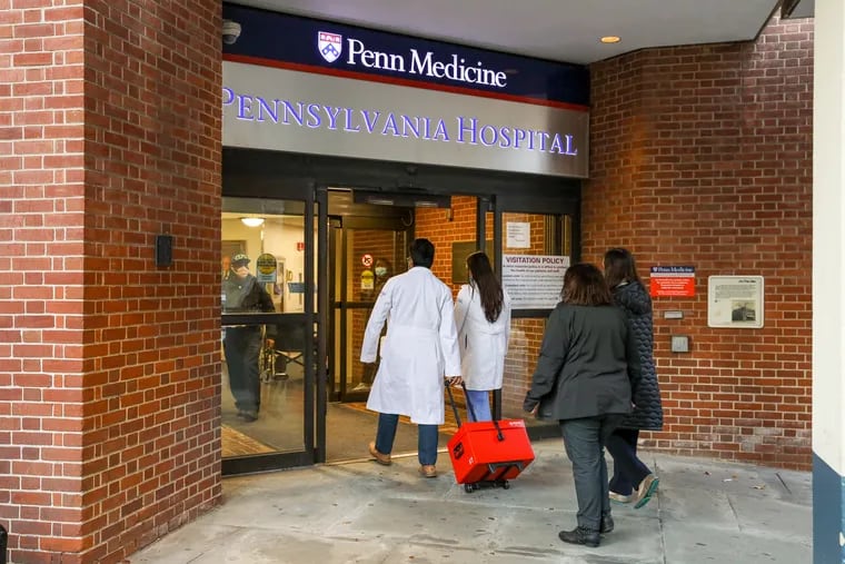 Staff entering Penn Medicine's Pennsylvania Hospital last December.