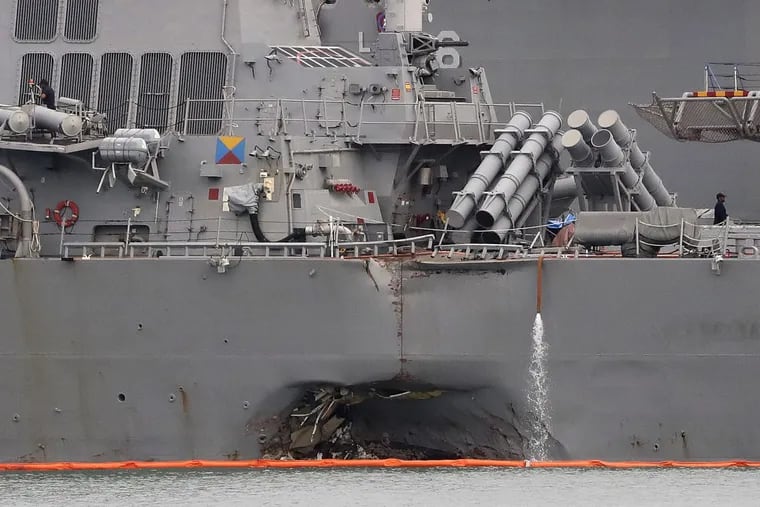 The damaged port aft hull of the USS John S. McCain.
