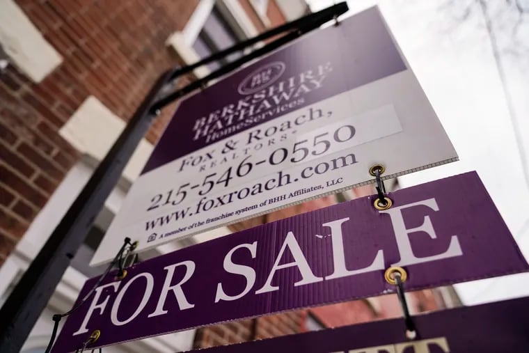 A for sale sign is posted on a home in Philadelphia on Jan. 4, 2023. Both prices and home sales in the city fell in the fourth quarter of 2022, according to Drexel economist Kevin Gillen.