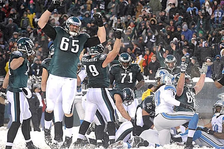Eagles players celebrate a touchdown by Nick Foles during the second half. (Michael Perez/AP)