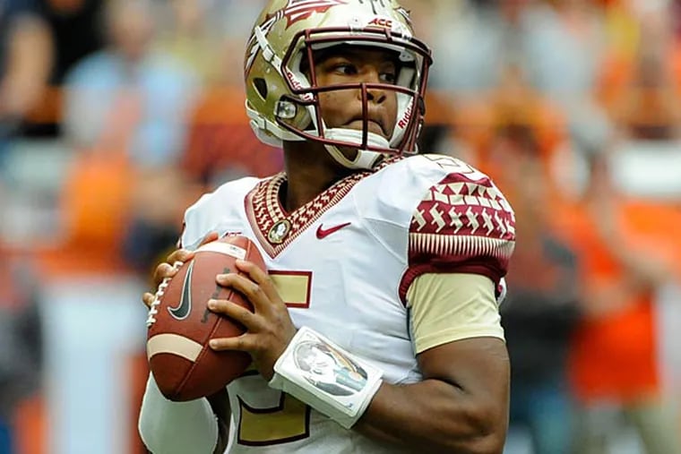 Florida State Seminoles quarterback Jameis Winston (5) drops back to pass against the Syracuse Orange during the third quarter at the Carrier Dome. Florida State defeated Syracuse 38-20. ()Rich Barnes/USA Today)