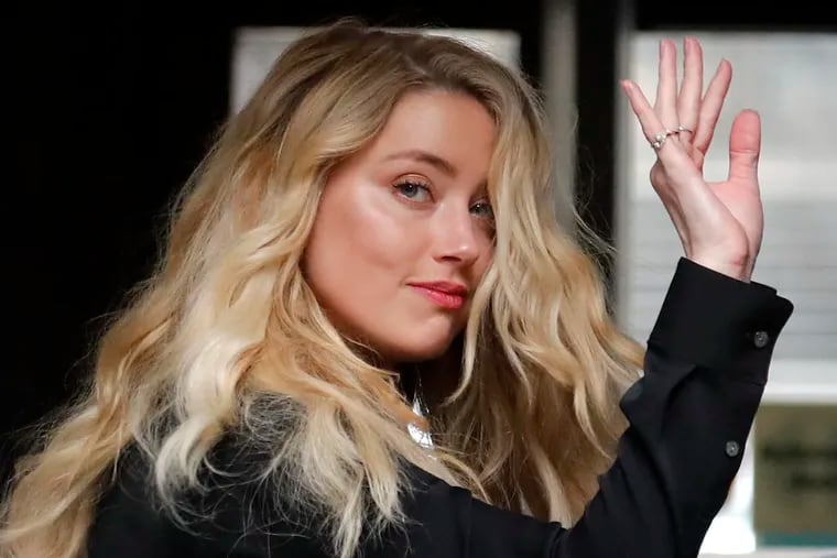 A collective of doctors, professors, advocates against domestic violence and women’s rights activists have signed an open letter in support of Amber Heard. (AP Photo/Frank Augstein)
