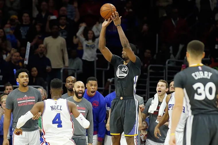 The Warriors' Harrison Barnes shoots the game winner with 0.2 seconds left in the game.