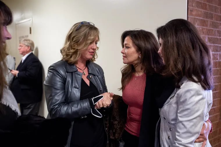 Former Miss America, Suzette Charles (center), of New Jersey, grips Shana Monteith, of Georgia (left), and Jennifer Vaden Barth, former Miss North Carolina, at Atlantic County Superior Court in Atlantic City. Vaden Barth is suing the current management of the Miss America Organization.