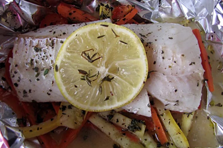 Cod With Lemon, Herbs and Wine is less expensive than using halibut. To cut costs even further, make only two servings. (Maureen Fitzgerald)