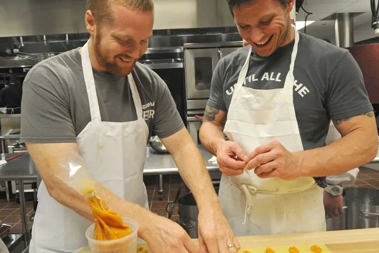 Chef/partners Brad Spence (left), Jeff Michaud make pumpkin tortellini at Osteria in Moorestown.