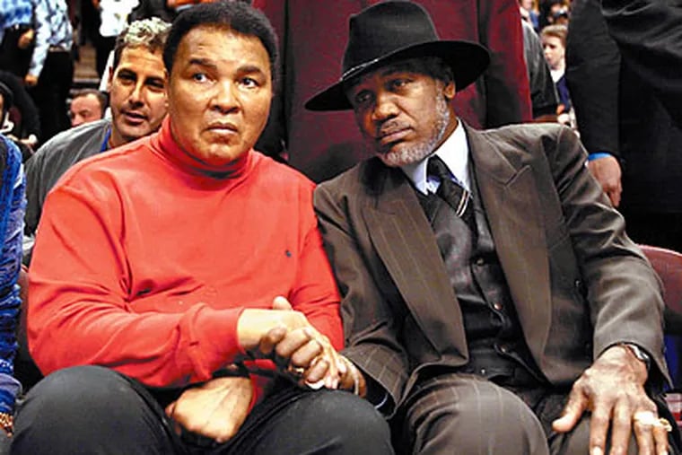 Joe Frazier with Muhammad Ali at the 2002 NBA All-Star Game in Philadelphia. (George Reynolds/Daily News file photo)