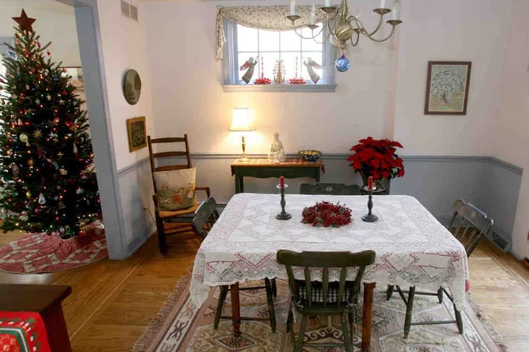 The dining room of the Smiths' home in Glenside. Throughout the house are artworks created by Landis Smith's late father.