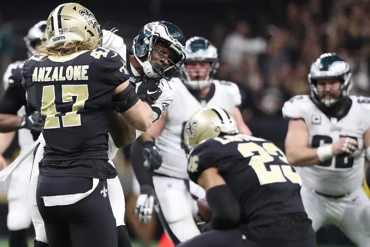 Eagles wide receiver Alshon Jeffery, left, watches as the New Orleans Saints cornerback Marshon Lattimore, right, intercepts a pass that bounced away from him in the 4th quarter. Philadelphia Eagles lose 20-14 to the New Orleans Saints in the NFL Divisional Round playoff game in New Orleans, LA on January 13, 2019.