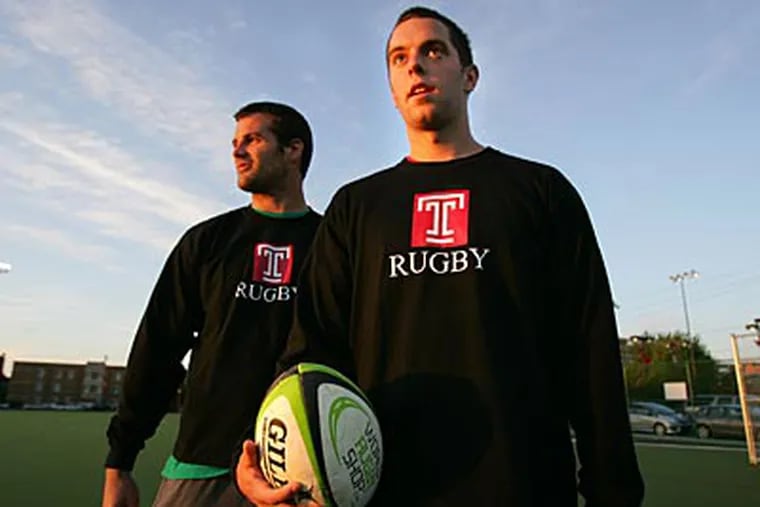 Temple co-captains Gareth Jones (left) and James O'Brien finish rugby practice on Monday. (David Swanson/Staff Photographer)