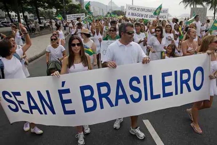 Residents of Rio de Janeiro hold up a banner proclaiming &quot;Sean is Brazilian&quot; in Portuguese during a protest in March against efforts to return the boy to the United States.