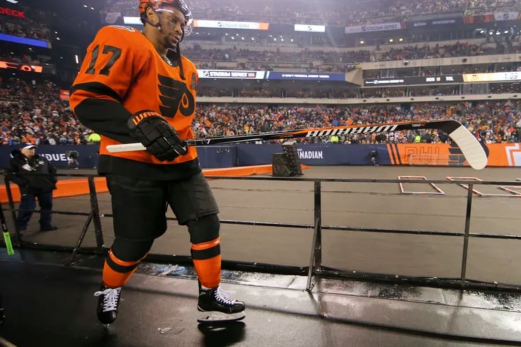 Wayne Simmonds returns to the ice between periods on Saturday night at Lincoln Financial Field.